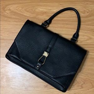 Black purse with gold details